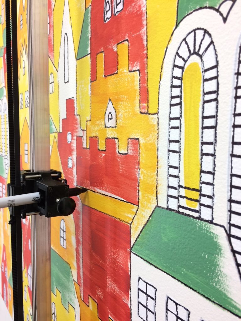 Botsy draws the outline over the color painted layer.